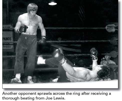 Another opponent sprawls across the ring after receiving a thorough beating from Joe Lewis.