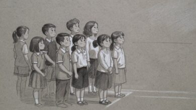 A group of children standing together watching something off to one side, none of them moving