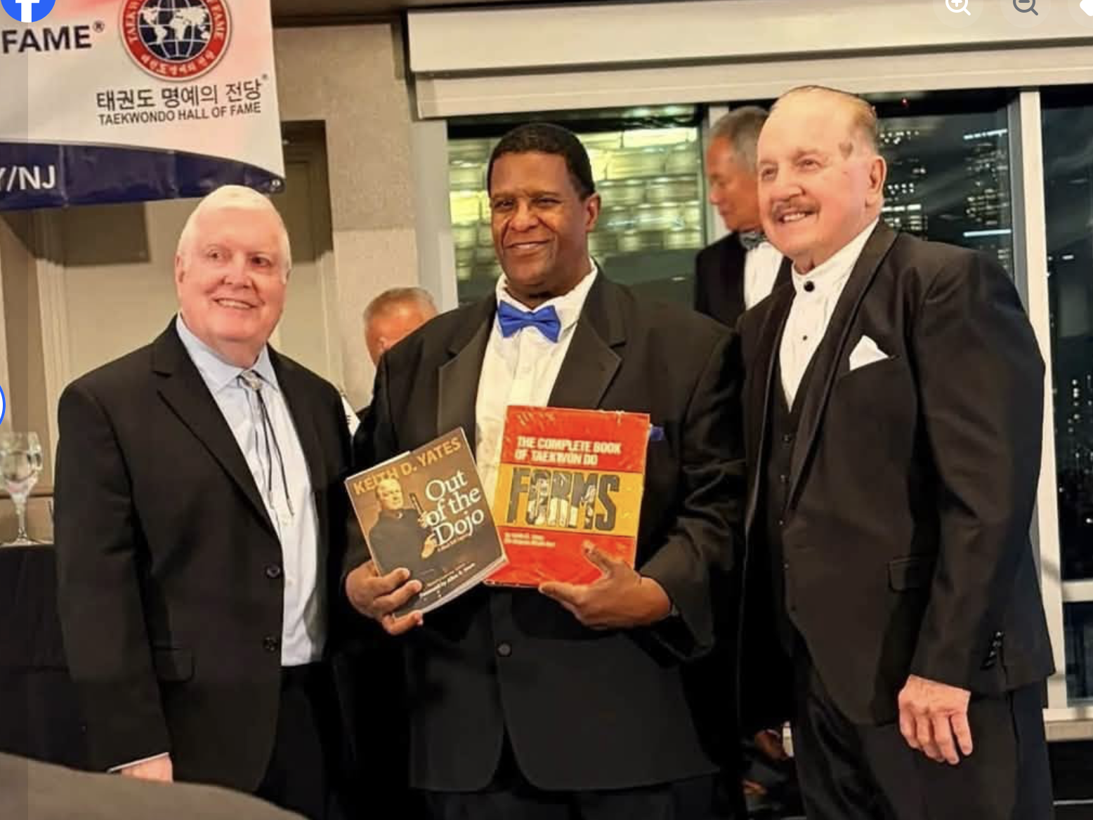 Grandmaster Keith D. Yates presenting first edition books to the museum, with Grandmaster Gerard Robbins and Grandmaster Jeff Smith