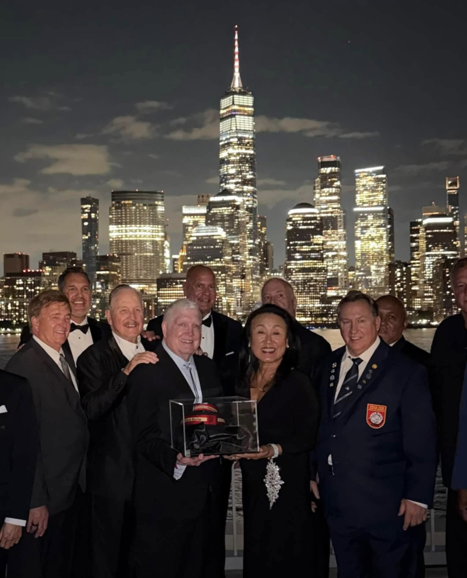 Honorees including Stephen Oliver, Jeff Smith, Keith Yates and Helen Chung gathered before the Manhattan skyline at the 2026 ceremony