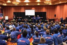 Grand Master Jeff Smith and Grand Master Stephen Oliver teaching a large group of students at a Mile High Karate event