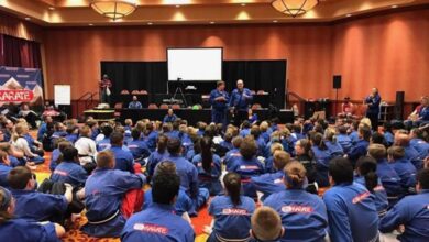 Grand Master Jeff Smith and Grand Master Stephen Oliver teaching a large group of students at a Mile High Karate event