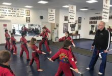 Grand Master Jeff Smith leading instruction on the training floor