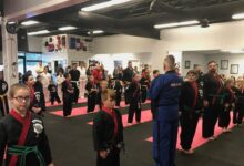 Grand Master Jeff Smith working with students during a class