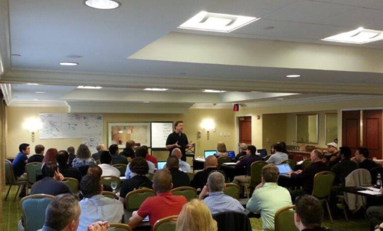 Grand Master Stephen Oliver speaking to martial arts school owners at a training event