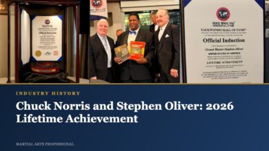 Chuck Norris black belt in its case, Keith Yates presenting books, and Stephen Oliver induction certificate