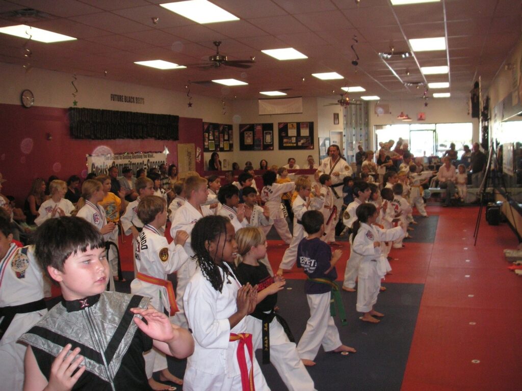 A full KarateBuilt Martial Arts class of students in uniform on the mat